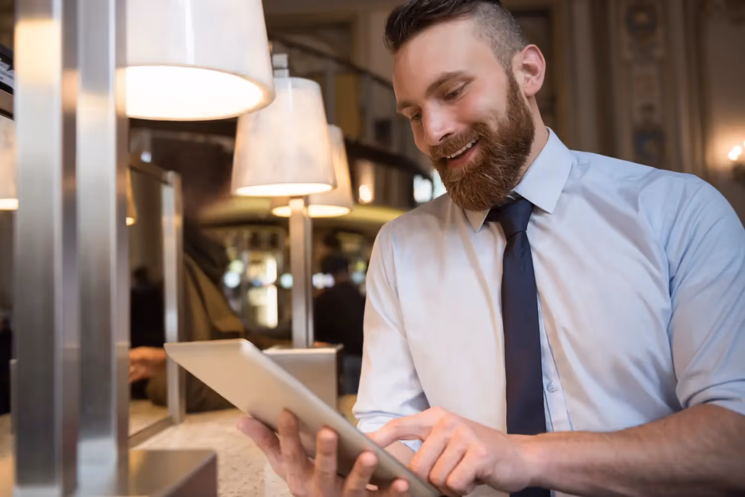An Hospitality expert working on a tablet