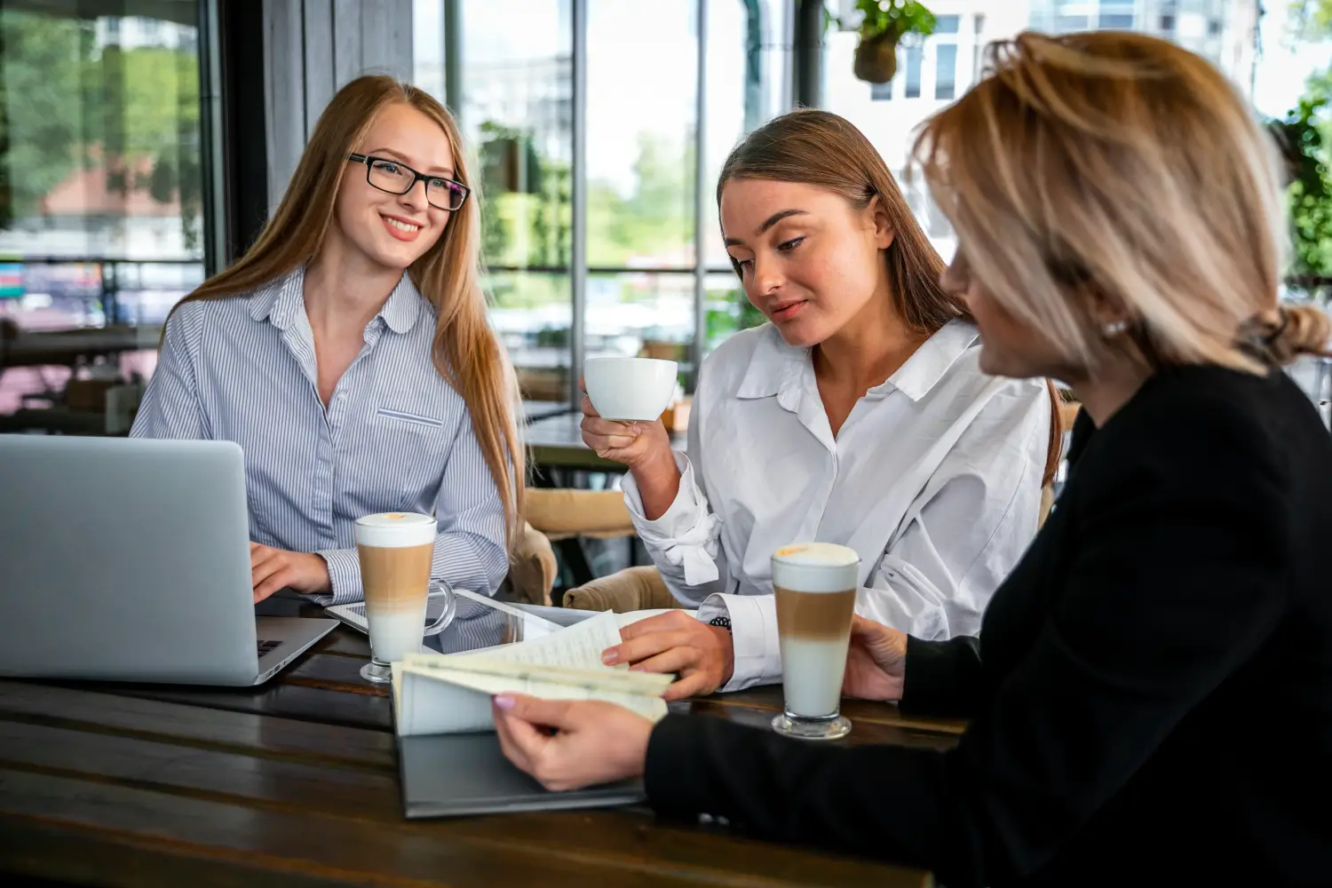 Retail bussines owners having coffee while discussing