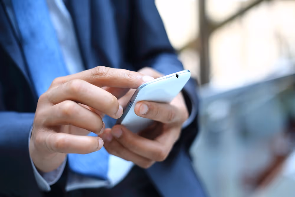 Handing holding a phone depicting Voip solution offered by Allsafe IT